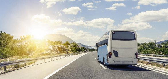 Bus rushes along the asphalt high-speed highway. © Denis Rozhnovsky - stock.adobe.c