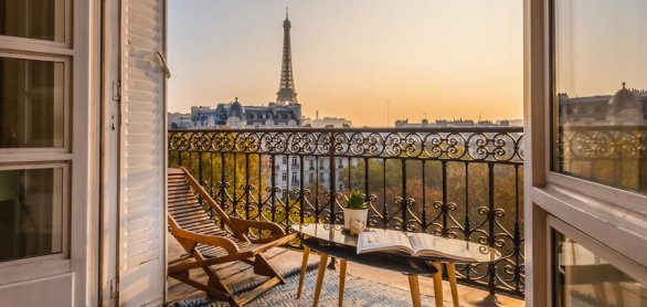 beautiful paris balcony at sunset with eiffel tower view © Karen Mandau - stock.adobe.com