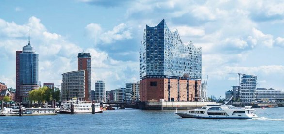 Hamburg, elbphilharmonie and modern buildings with boat to the h © mstein - stock.adobe.com